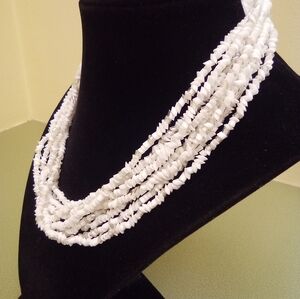 Eight tier beaded necklace white with some clear beads 8 inches long